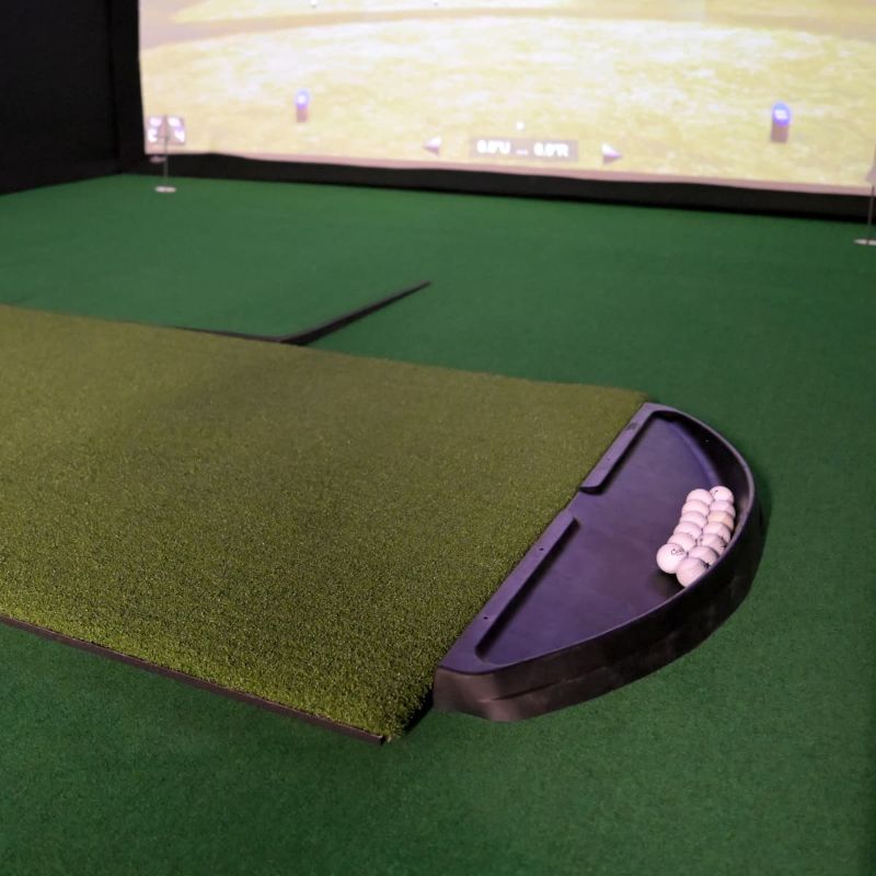 Carl's Place golf ball tray and hotshot hitting mat in a simulator